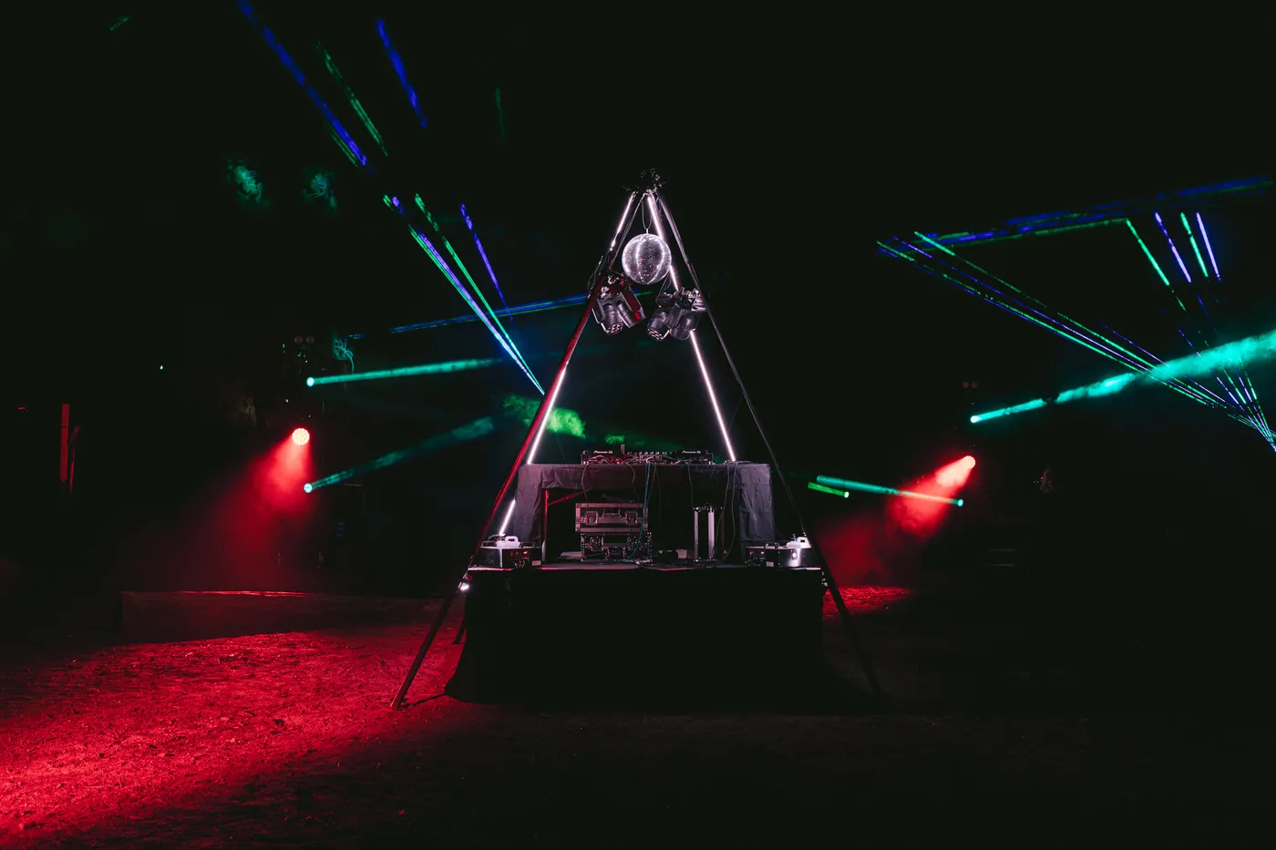 Red uplights and blue-green lasers over the dance floor